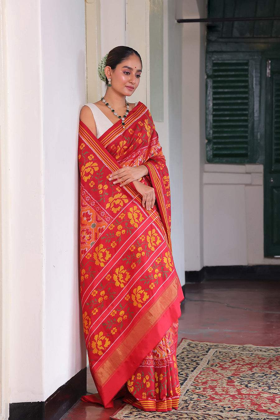 Elegant Handloom Peach and Red Mulberry Silk Ikat Patola Saree with Floral Motifs