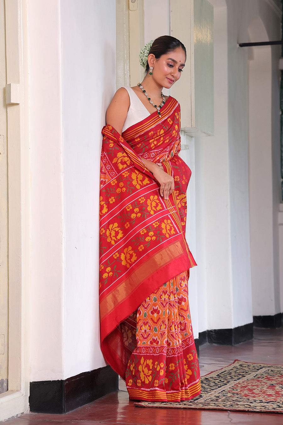 Elegant Handloom Peach and Red Mulberry Silk Ikat Patola Saree with Floral Motifs