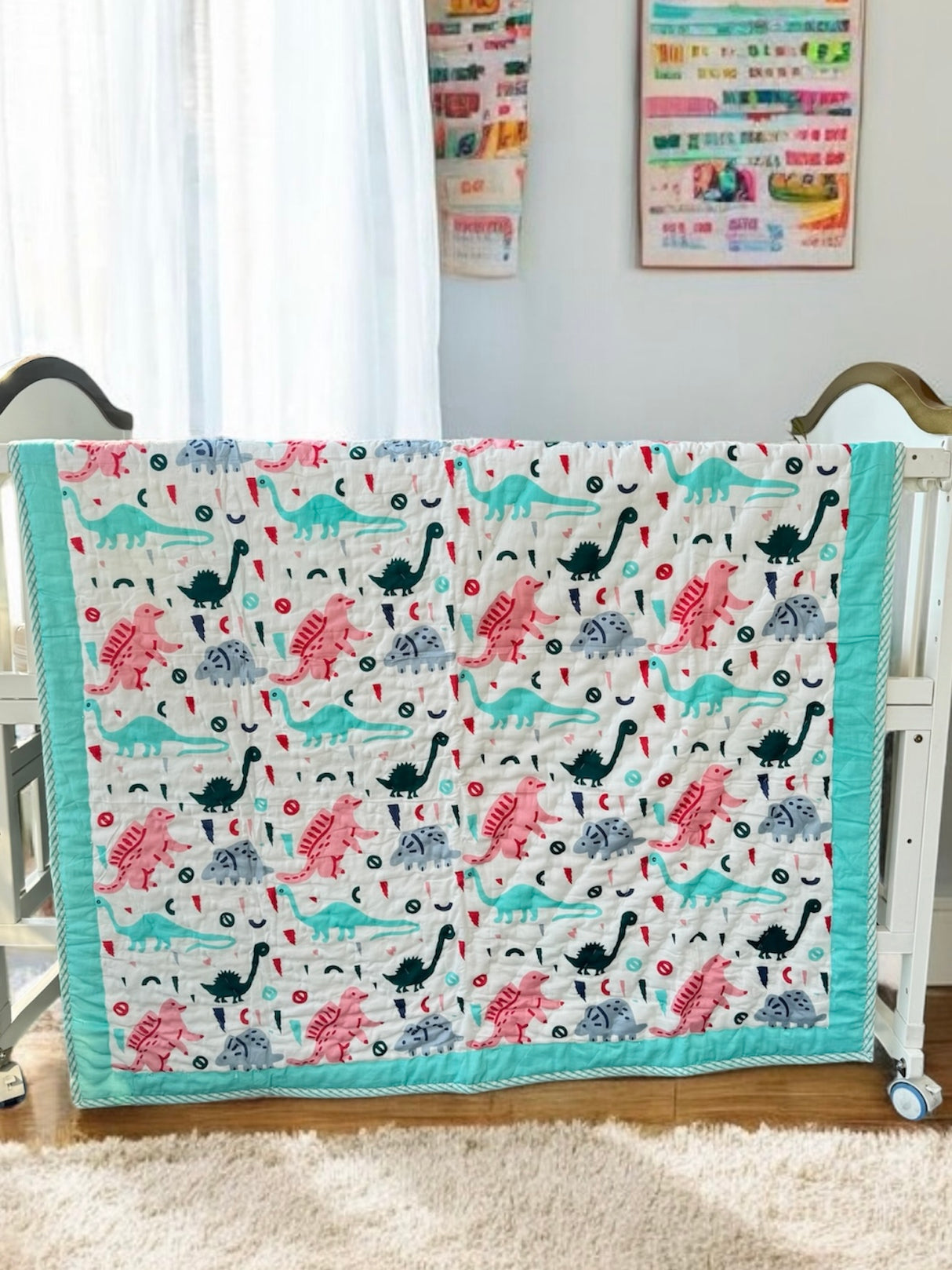 reversible quilt for kids with turquoise dinosaur jungle theme handcrafted in India for resale in South Africa and Singapore
