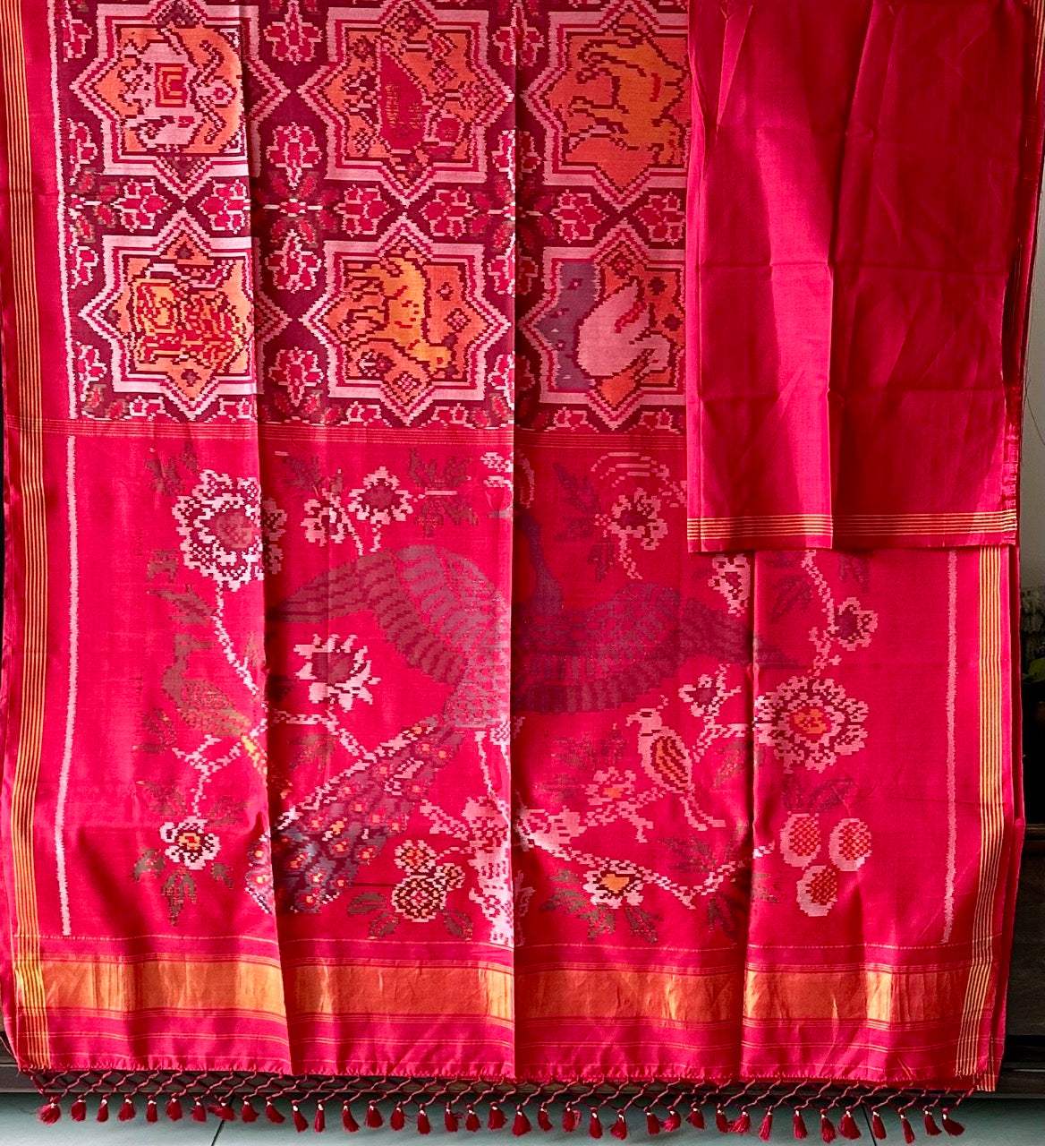 Sophisticated Handloom Brown and Red Mulberry Silk Ikat Patola Saree with Animal Motifs