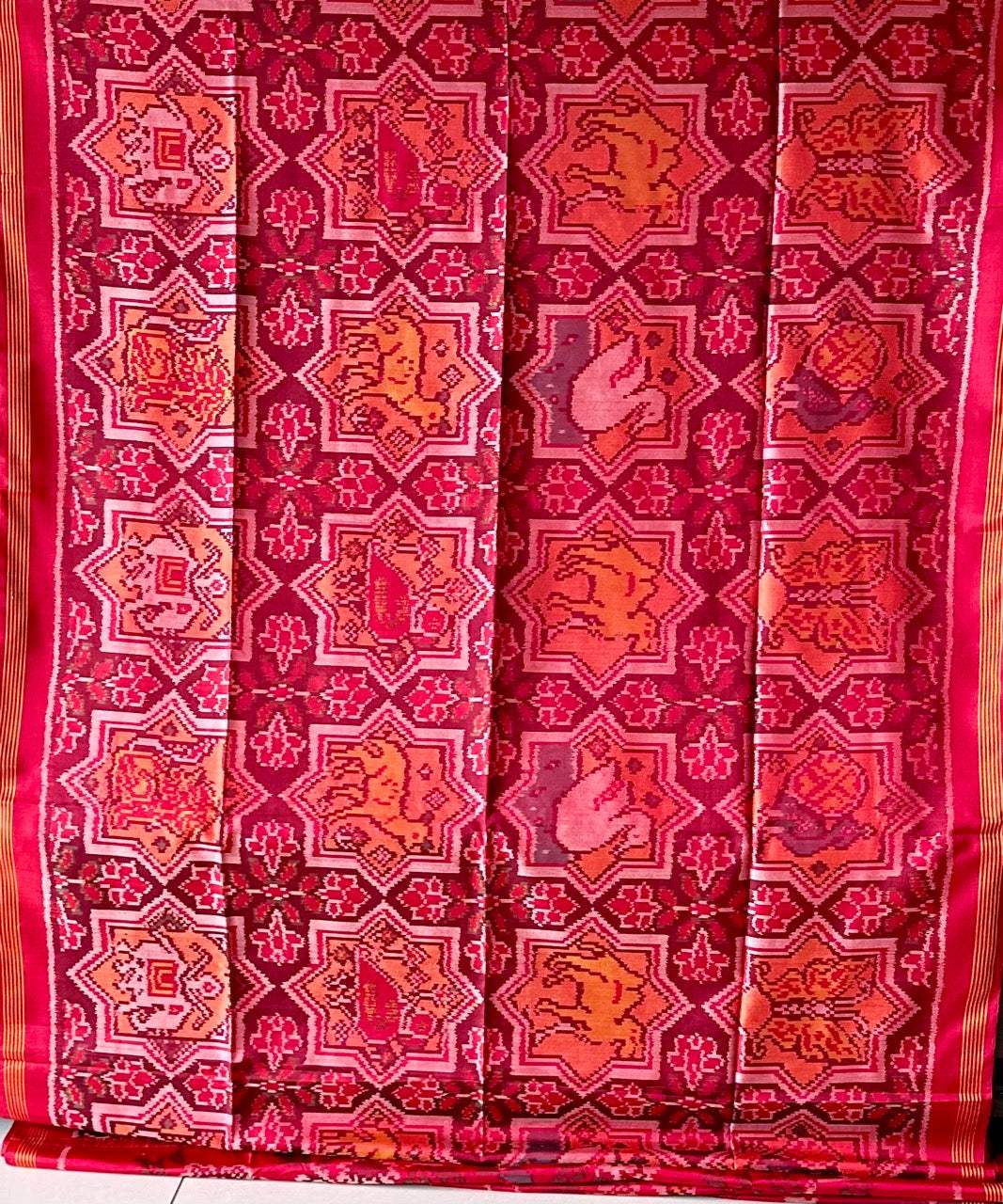 Sophisticated Handloom Brown and Red Mulberry Silk Ikat Patola Saree with Animal Motifs