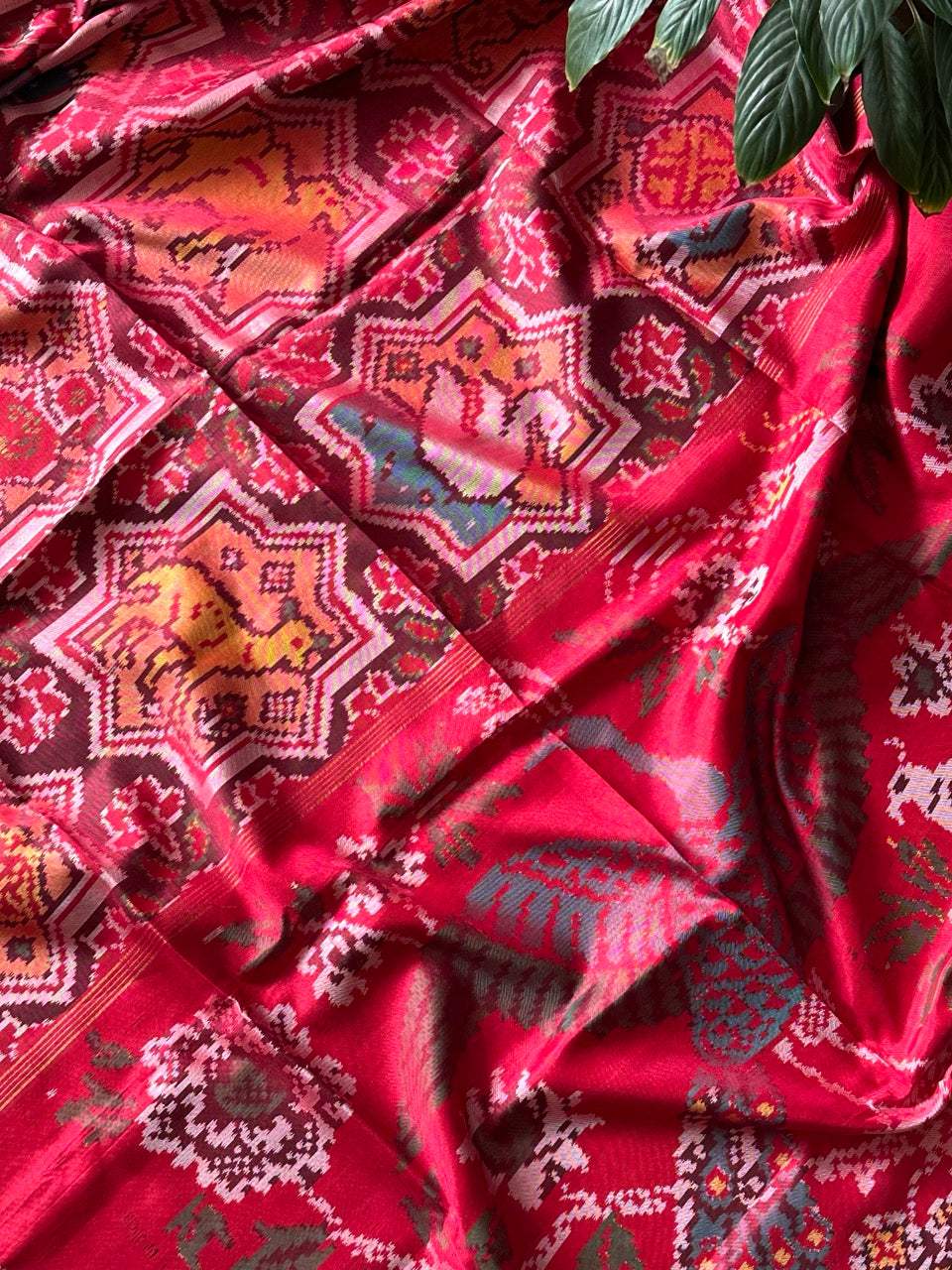 Sophisticated Handloom Brown and Red Mulberry Silk Ikat Patola Saree with Animal Motifs