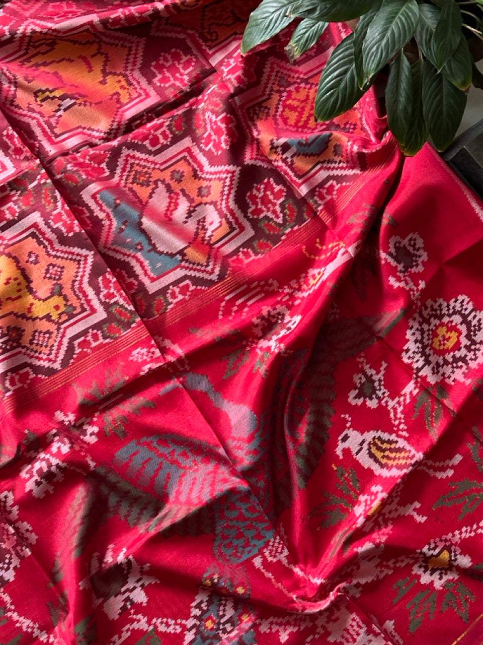 Sophisticated Handloom Brown and Red Mulberry Silk Ikat Patola Saree with Animal Motifs
