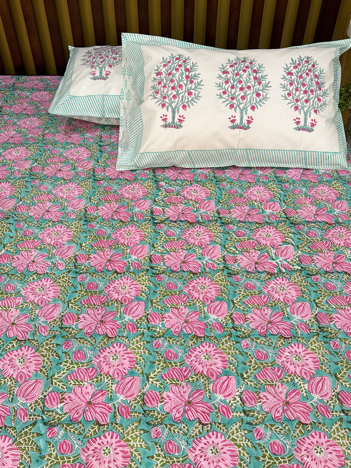 Pink and green printed bedsheet for wedding favours