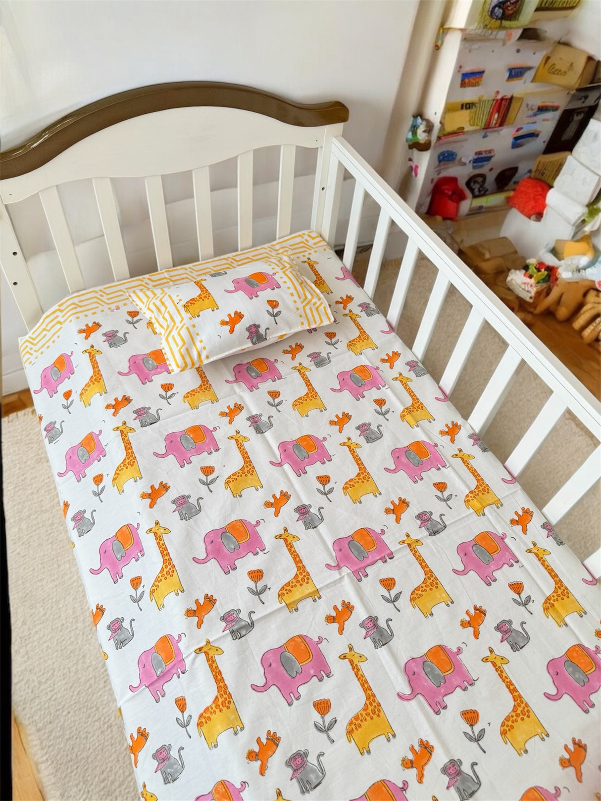 Pink yellow orange cot sheet for boys room