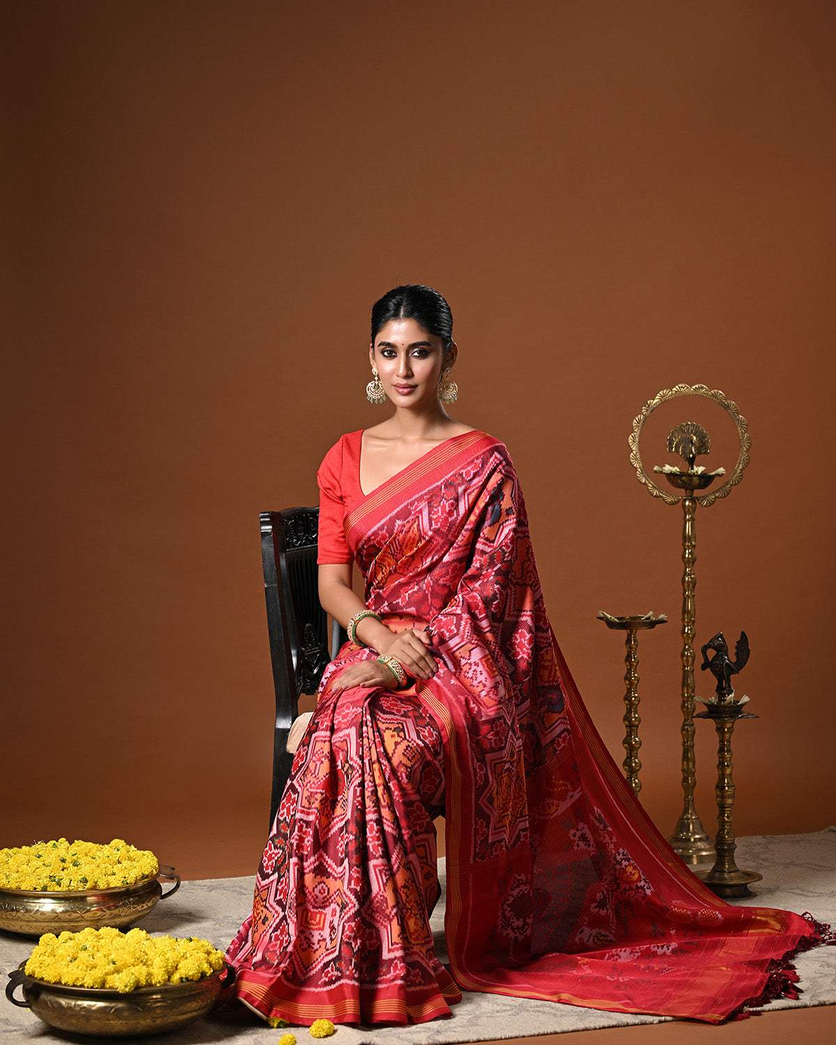Sophisticated Handloom Brown and Red Mulberry Silk Ikat Patola Saree with Animal Motifs