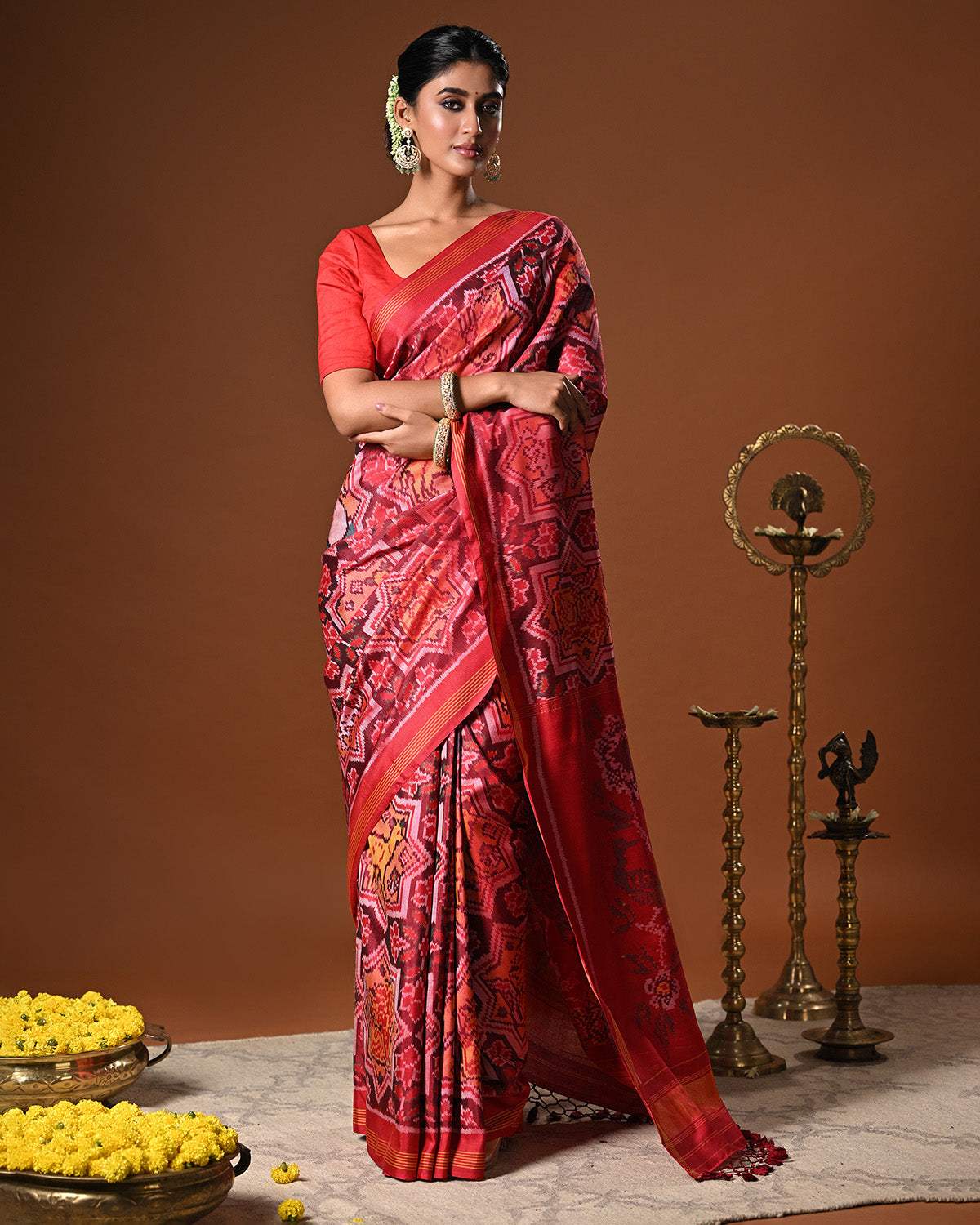 Sophisticated Handloom Brown and Red Mulberry Silk Ikat Patola Saree with Animal Motifs