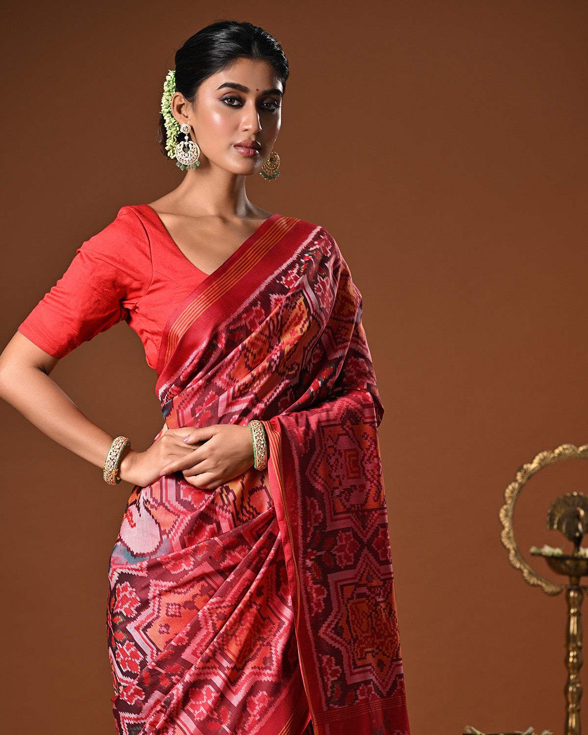 Sophisticated Handloom Brown and Red Mulberry Silk Ikat Patola Saree with Animal Motifs