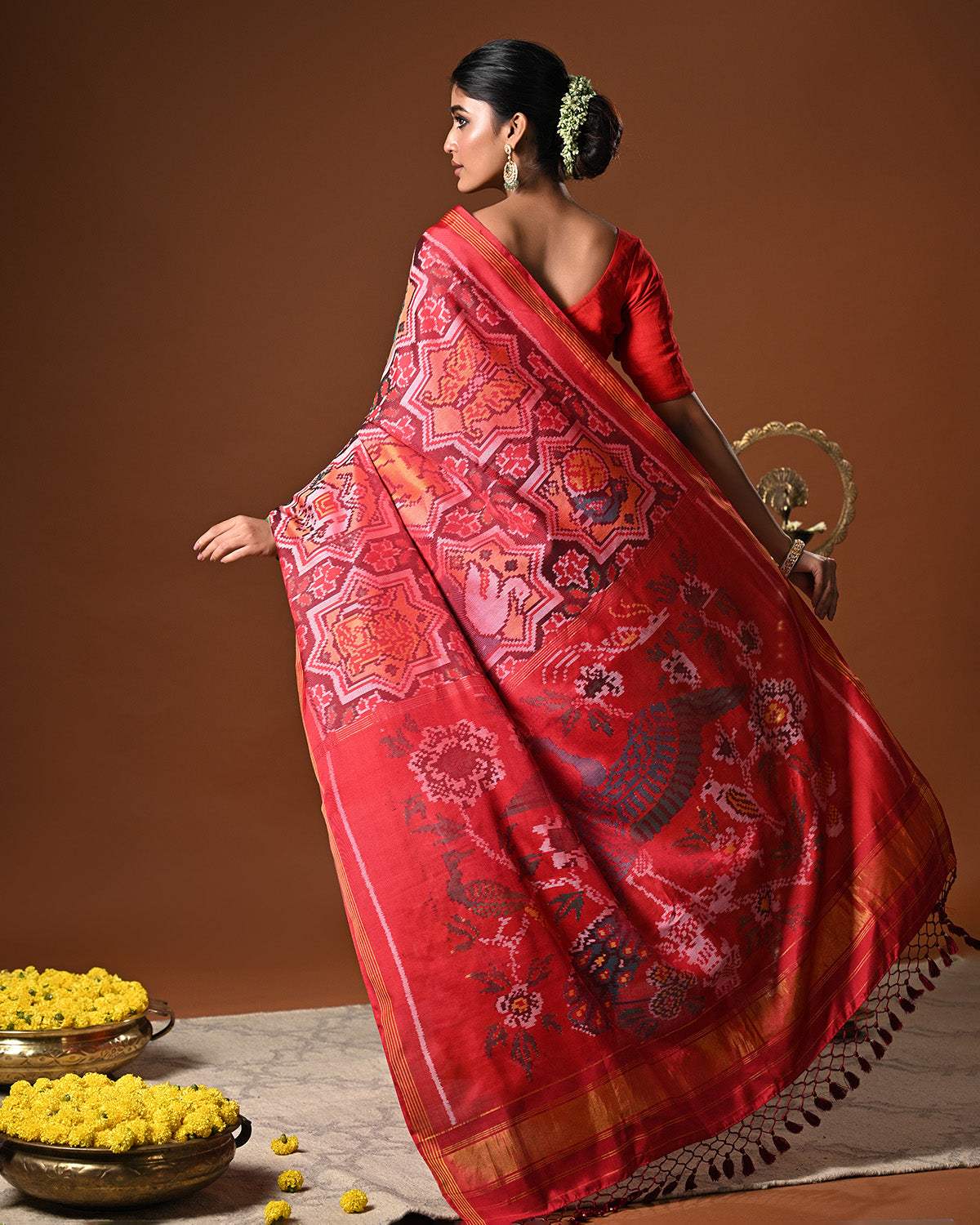 Sophisticated Handloom Brown and Red Mulberry Silk Ikat Patola Saree with Animal Motifs