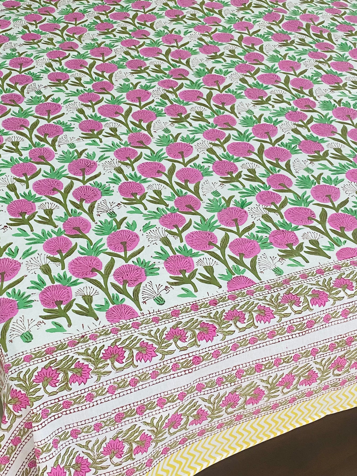 White fitted bedsheet with pink floral block print