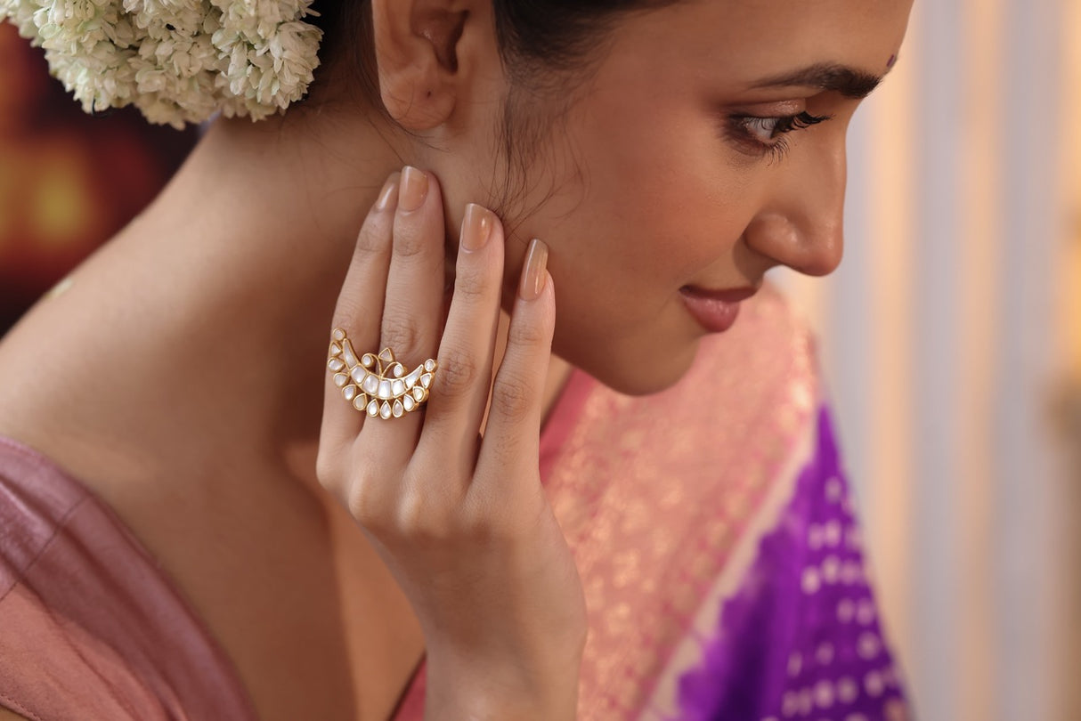 Woman wearing a delicate ring with a blurred background
