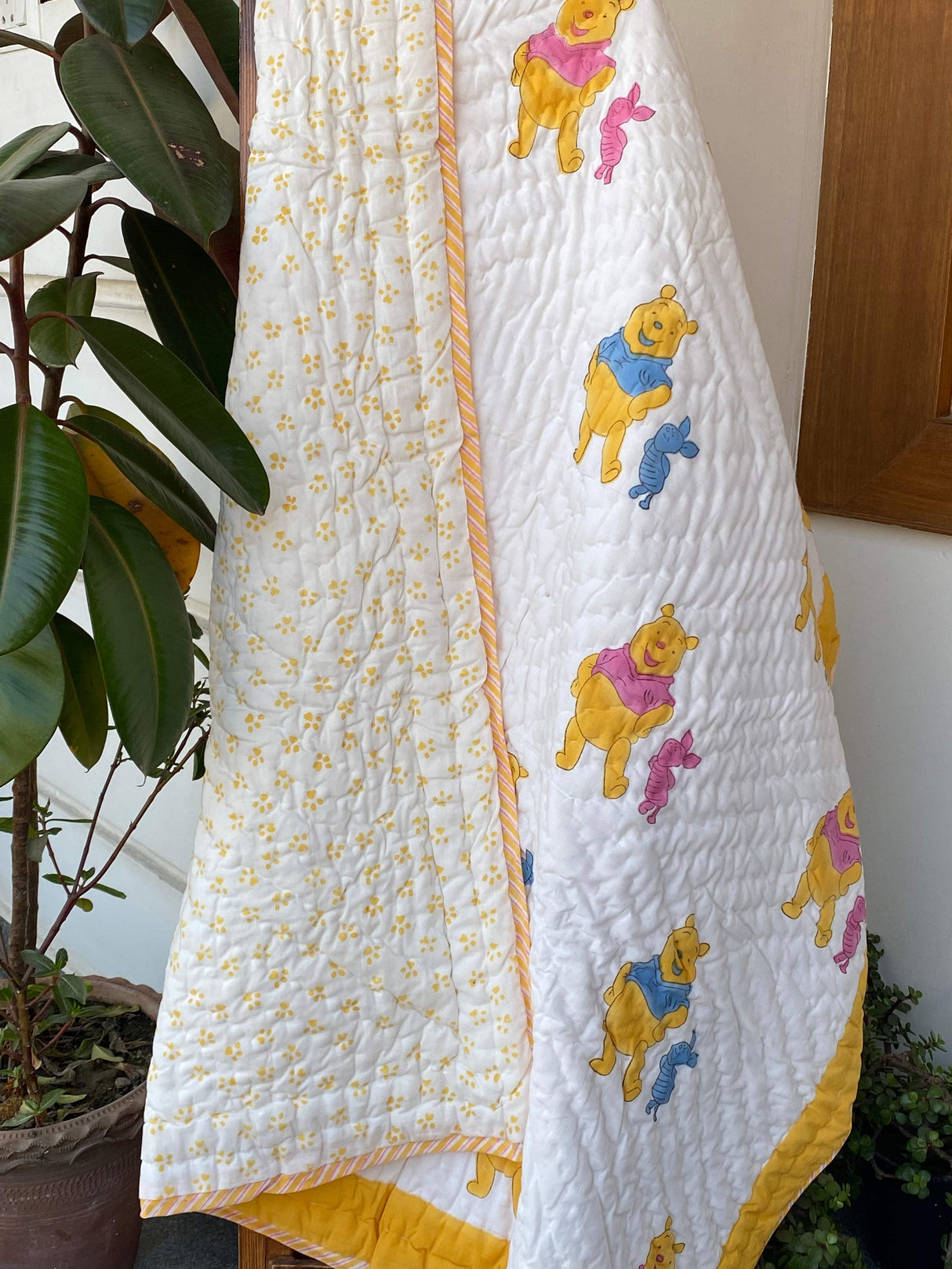 lightweight-eco-friendly-mulmul-kids-quilt-in-pink-and-blue-with-pooh-design-for-wholesale-in-new-zealand