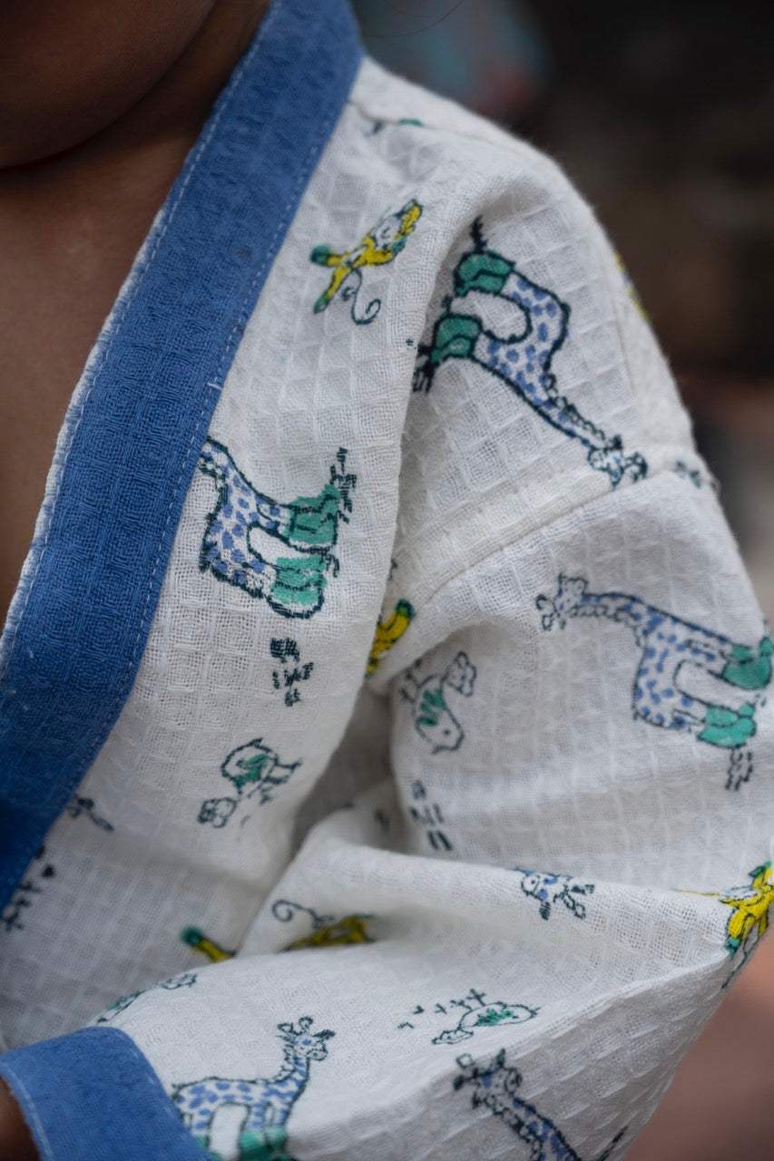 beach holiday essentials for kids handblock printed blue bathrobes with giraffe monkey nursery design