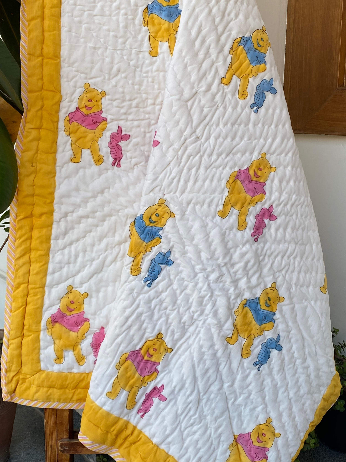 pastel-pink-and-blue-disney-themed-kids-quilt-handcrafted-in-jaipur-for-bulk-export-to-usa-and-singapore