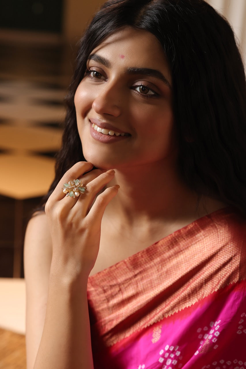 Woman wearing a pink saree with a 92.5 silver ring