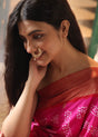 Woman wearing a pink saree with a lovely 92.5 silver nose ring with moissanite polki.