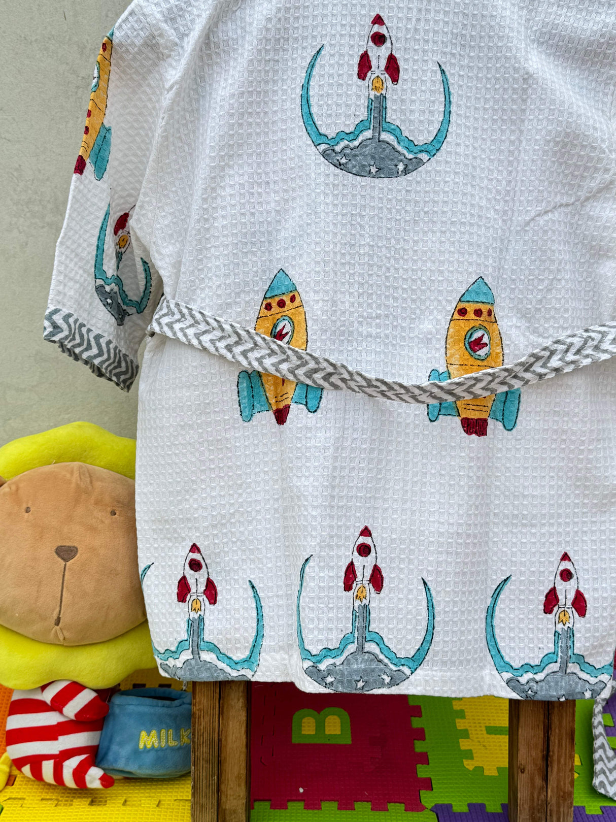 rocket print waffle kids bathrobe with embroidered name perfect for baby gifting and boutique reselling in switzerland uk and india
