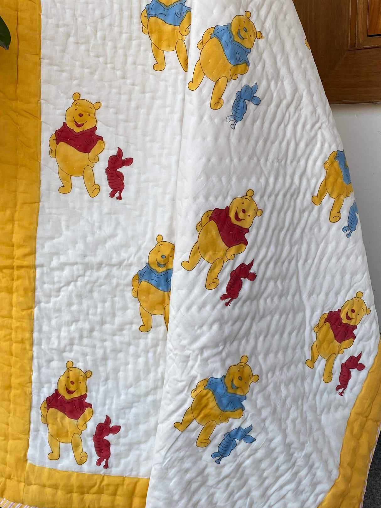 breathable-eco-friendly-cotton-kids-quilt-featuring-disney-pooh-handmade-in-jaipur-for-global-buyers