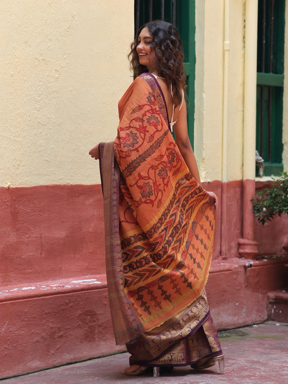 dull-orange-floral-cotton-kalamkari-saree-back-drape-view