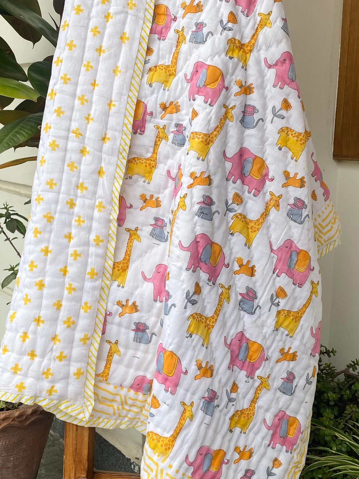 soft mulmul reversible baby quilt with jungle animals elephant and giraffe ideal for Indian buyers in UK and South Africa