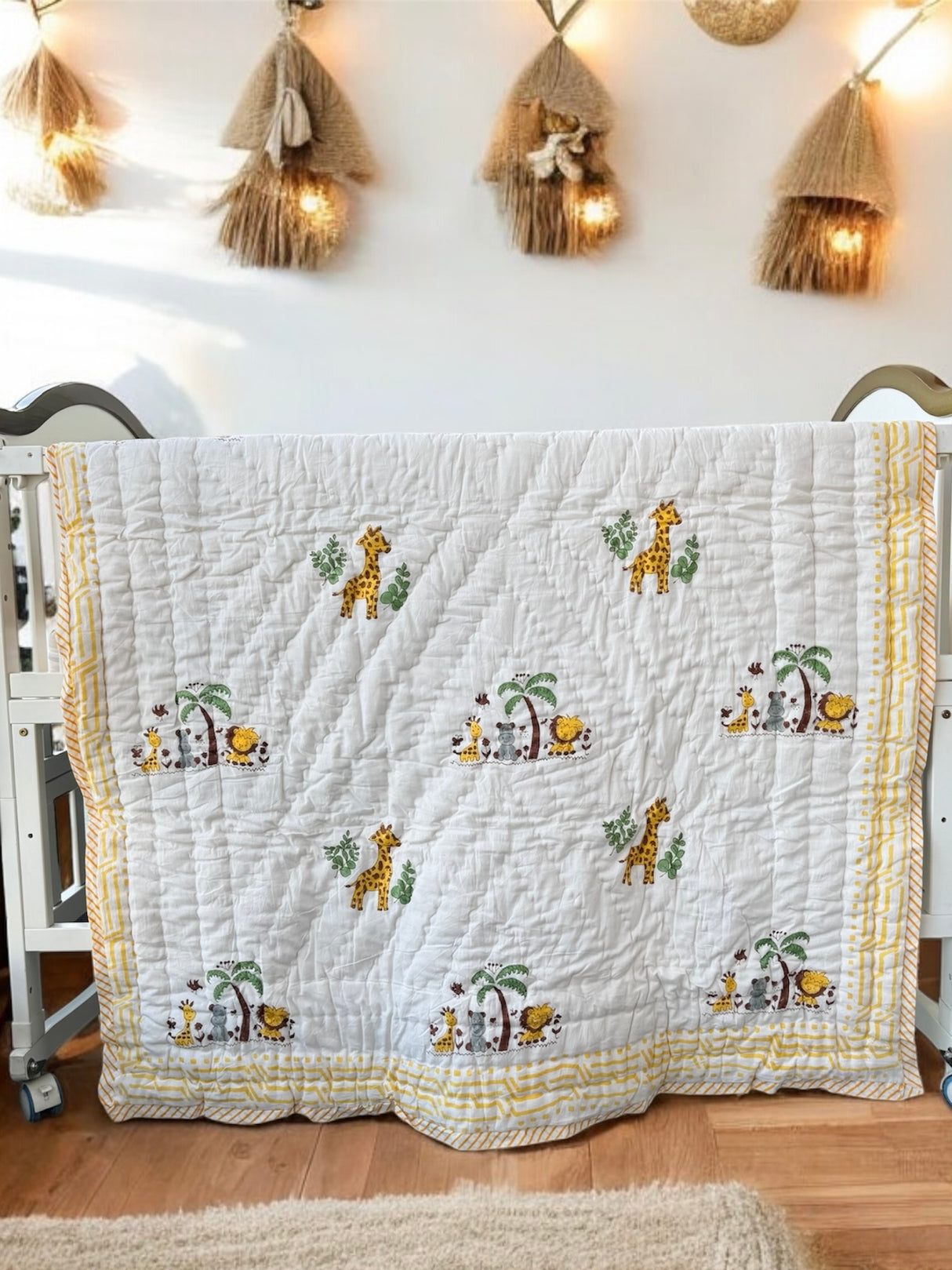 eco friendly cotton quilt for babies with adorable jungle animals elephant giraffe lion print handcrafted in India for gifting in UAE and Germany