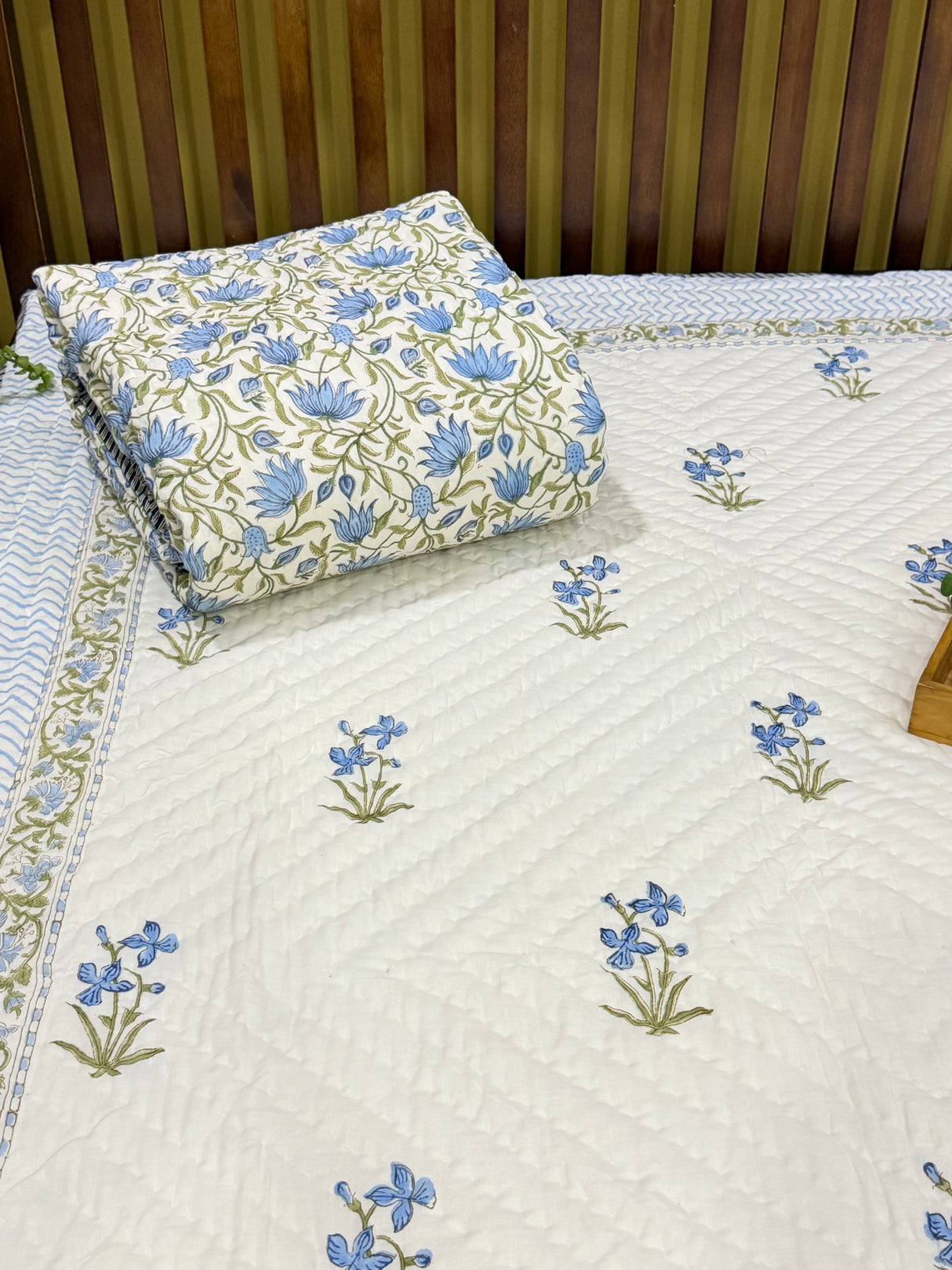 handcrafted-blue-floral-cotton-quilt-close-up-styling