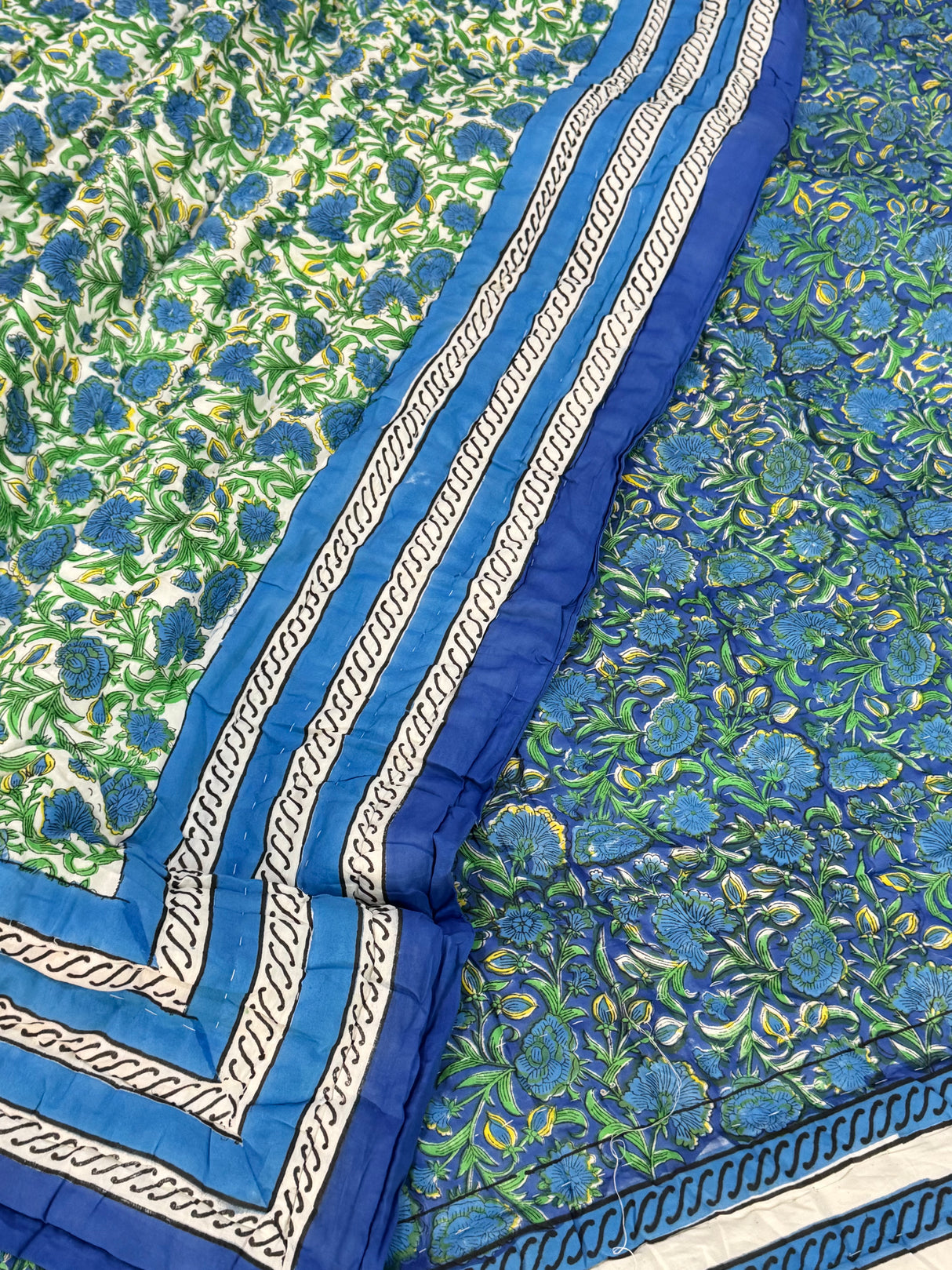 handcrafted-cotton-quilt-with-floral-border-detail