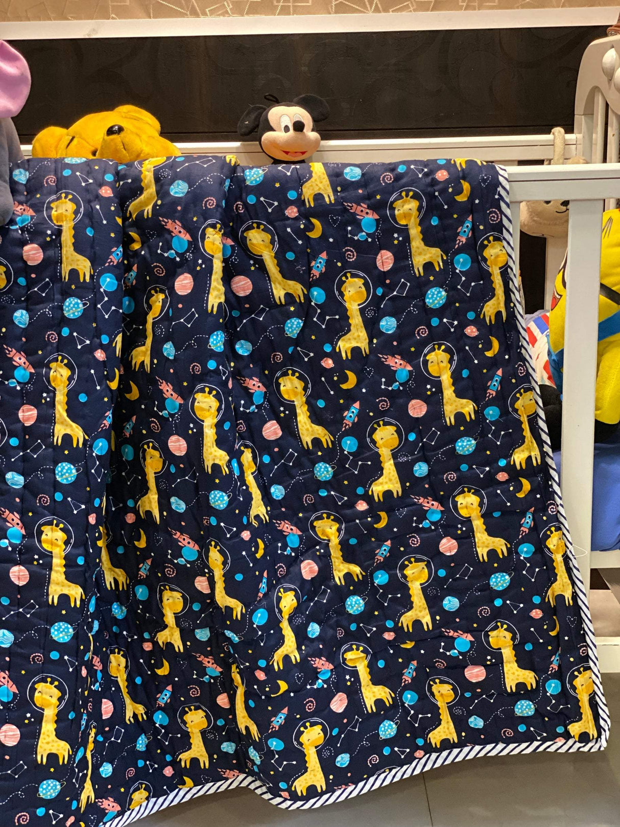 soft breathable mulmul cotton baby quilt with space theme and giraffe print perfect for toddlers in UAE and Australia