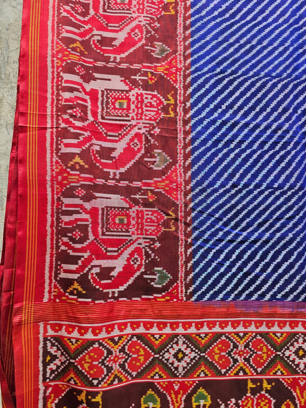 Exclusive Handloom Blue and Red Mulberry Silk Ikat Patola Saree with Leheriya and Gajraj Motifs