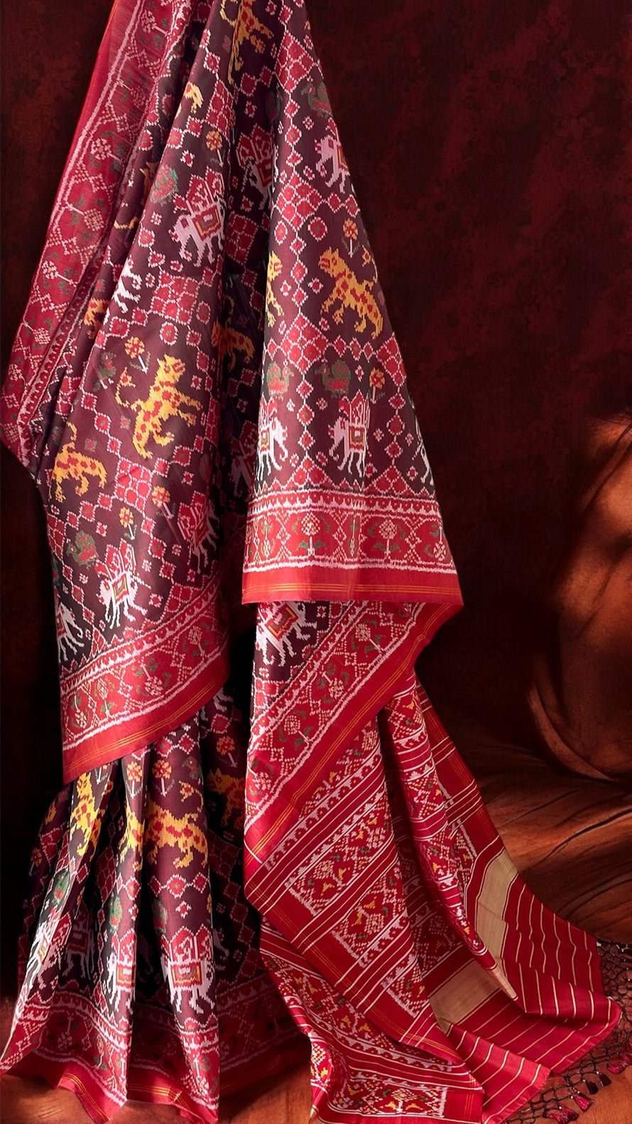 Graceful Handloom Brown and Red Mulberry Silk Ikat Patola Saree with Tiger and Elephant Motifs