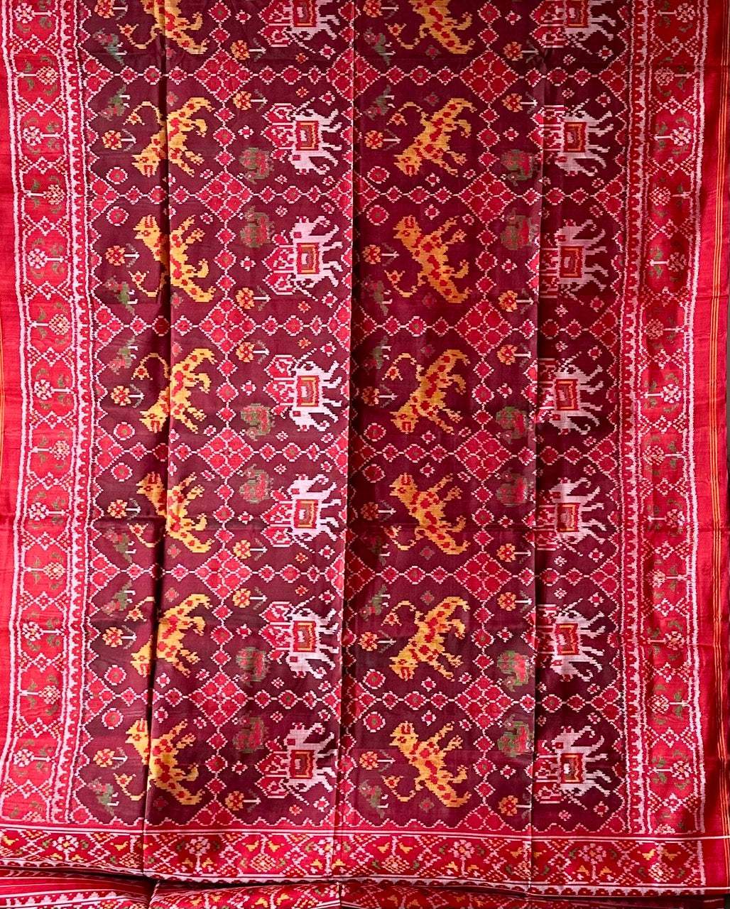 Graceful Handloom Brown and Red Mulberry Silk Ikat Patola Saree with Tiger and Elephant Motifs