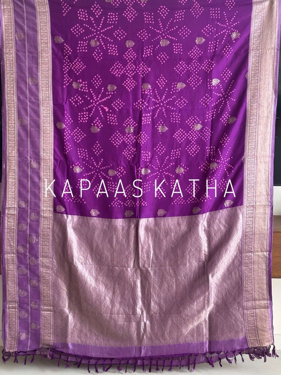 Buy pure Vasundhara silk Bandhani saree in royal magenta purple with gold zari leaf motifs & silver zari border. Authentic handwoven luxury online at Kapaas Katha.