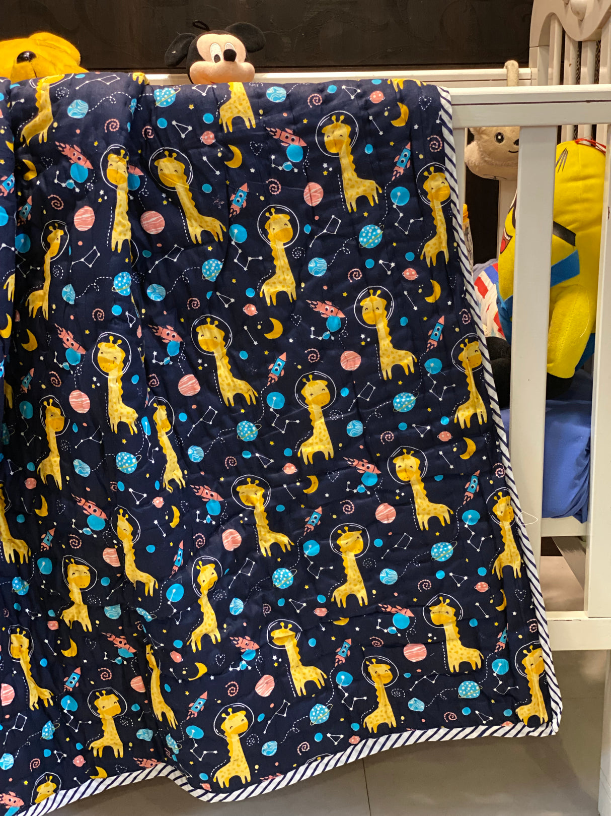 pastel baby quilt with starry night theme and blue giraffes handmade in Jaipur perfect for return favors in Dubai and UK