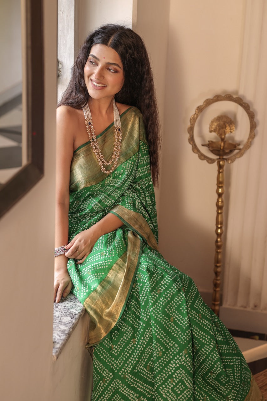 Woman in a green saree with 92.5 silver jewelry with moissanite polki  and pearls holding flowers indoors