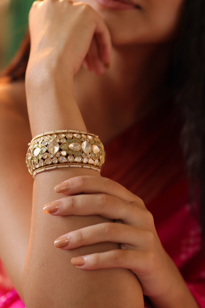 Woman in a pink saree wearing 92.5 silver statement kada