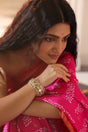 Woman in a pink saree wearing 92.5 silver statement kada