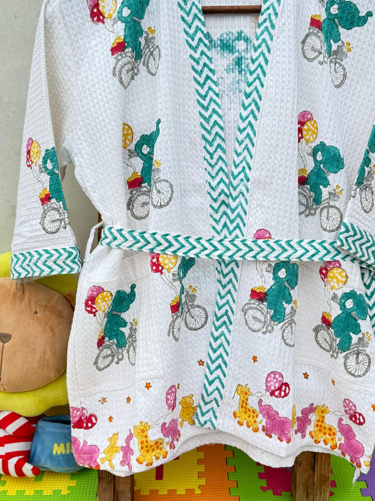 customizable waffle cotton kids bathrobe with embroidered name ideal for return gifts and bulk resale in Singapore and Netherlands