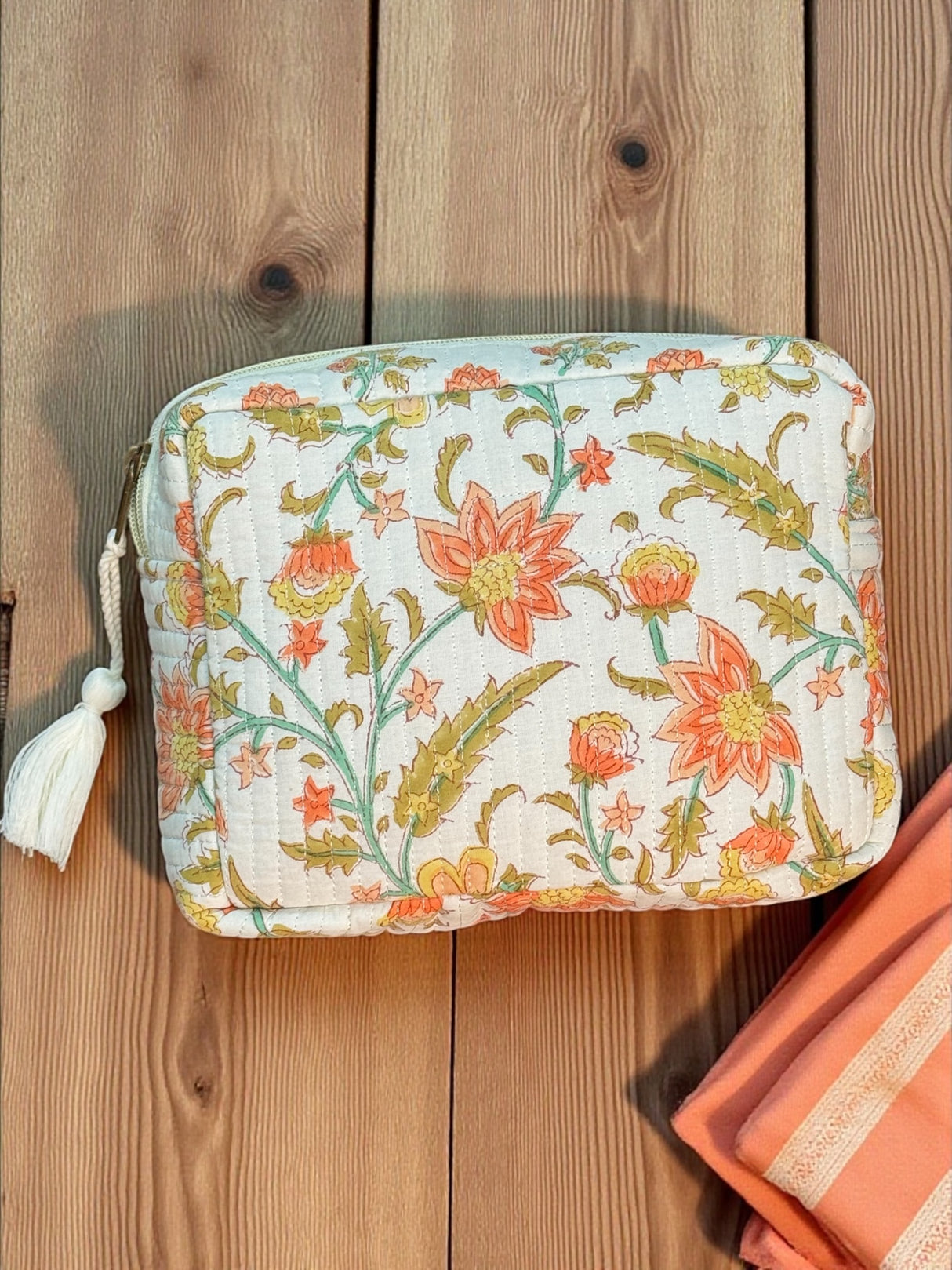 premium-handprinted-amber-petal-quilted-travel-pouch