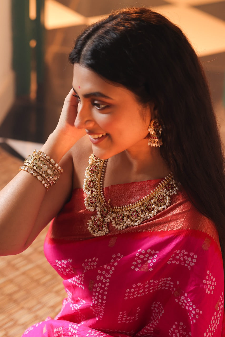 Woman wearing a traditional red saree with 92.5 silver jewelry called guttapusalu with lovely jhumkis