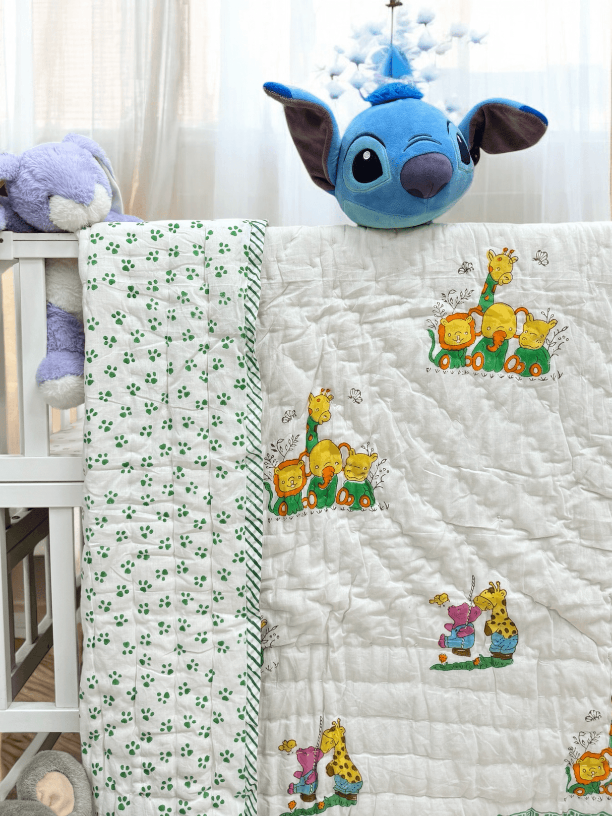 soft pastel baby quilt with cute giraffes and chill jungle animals made in Jaipur perfect for gifting in Canada and UK