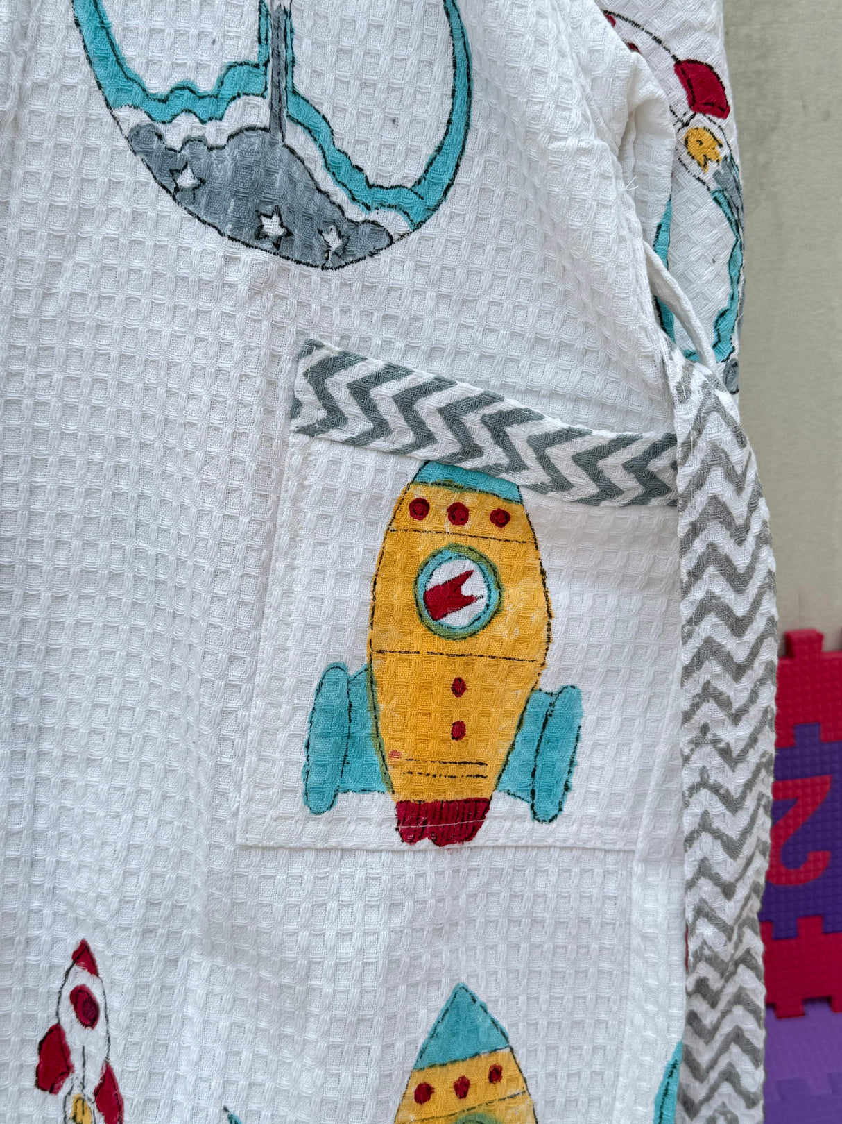 waffle cotton kids bathrobe with space rocket block prints embroidered with name suitable for gifting and reseller orders in usa and australia