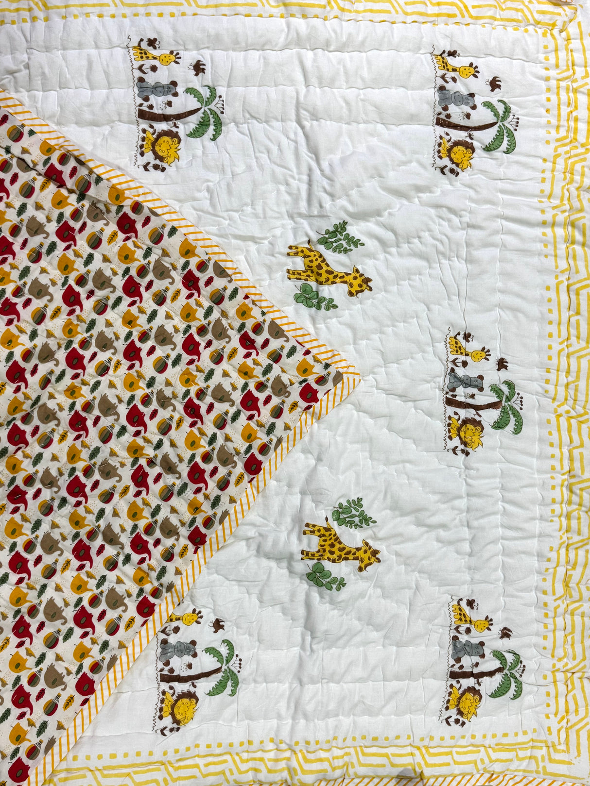 cute jungle safari baby quilt in pastel tones with elephants and giraffe friends print for Indian parents in USA and South Africa