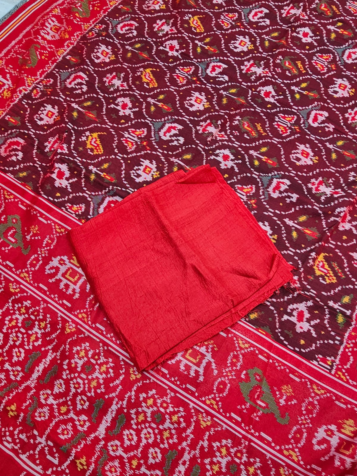 sophisticated-handloom-brown-and-red-mulberry-silk-ikat-patola-saree-with-animal-motifs