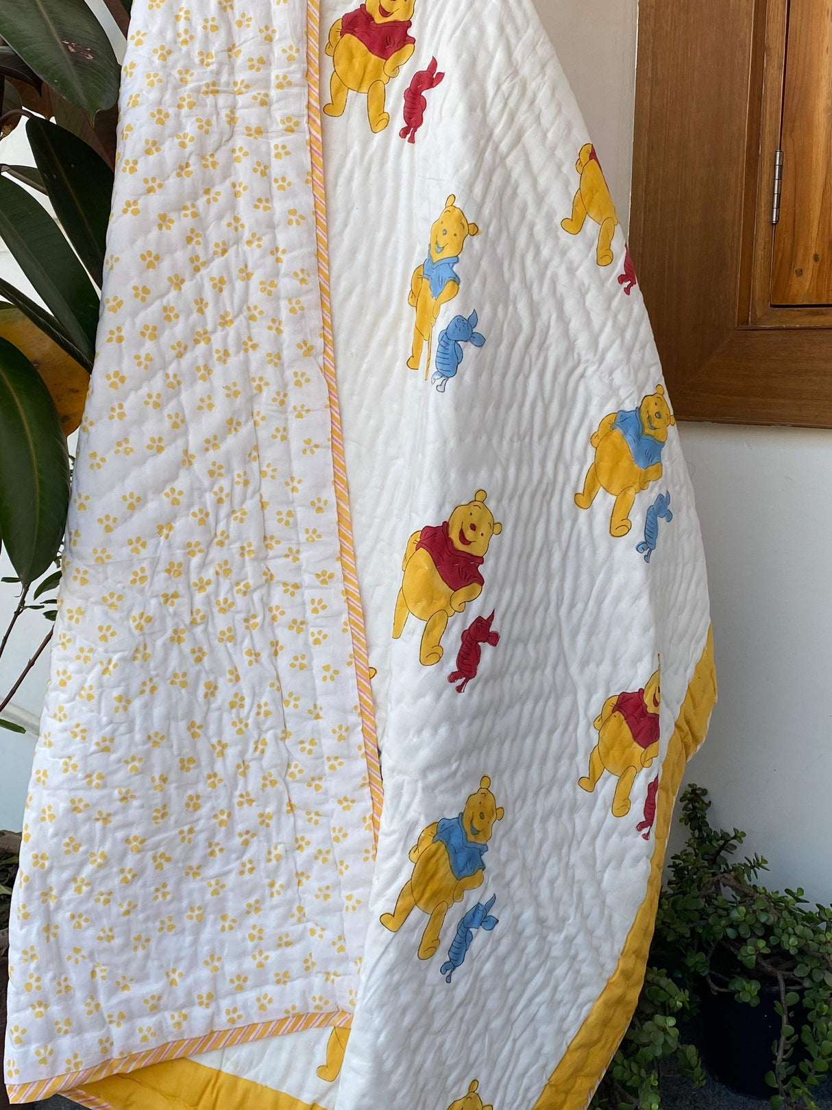 handcrafted-red-pooh-print-quilt-for-kids-in-cotton-perfect-for-birthday-return-gifts-in-usa-and-canada