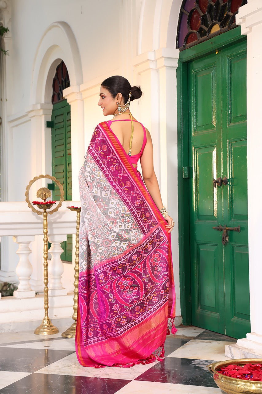 Timeless Handloom White and Pink Mulberry Silk Ikat Patola Saree with Intricate Navratna Motif