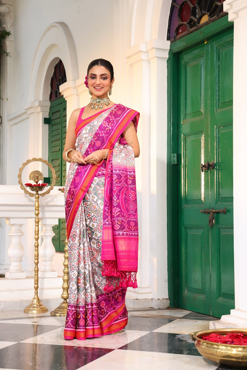 Timeless Handloom White and Pink Mulberry Silk Ikat Patola Saree with Intricate Navratna Motif