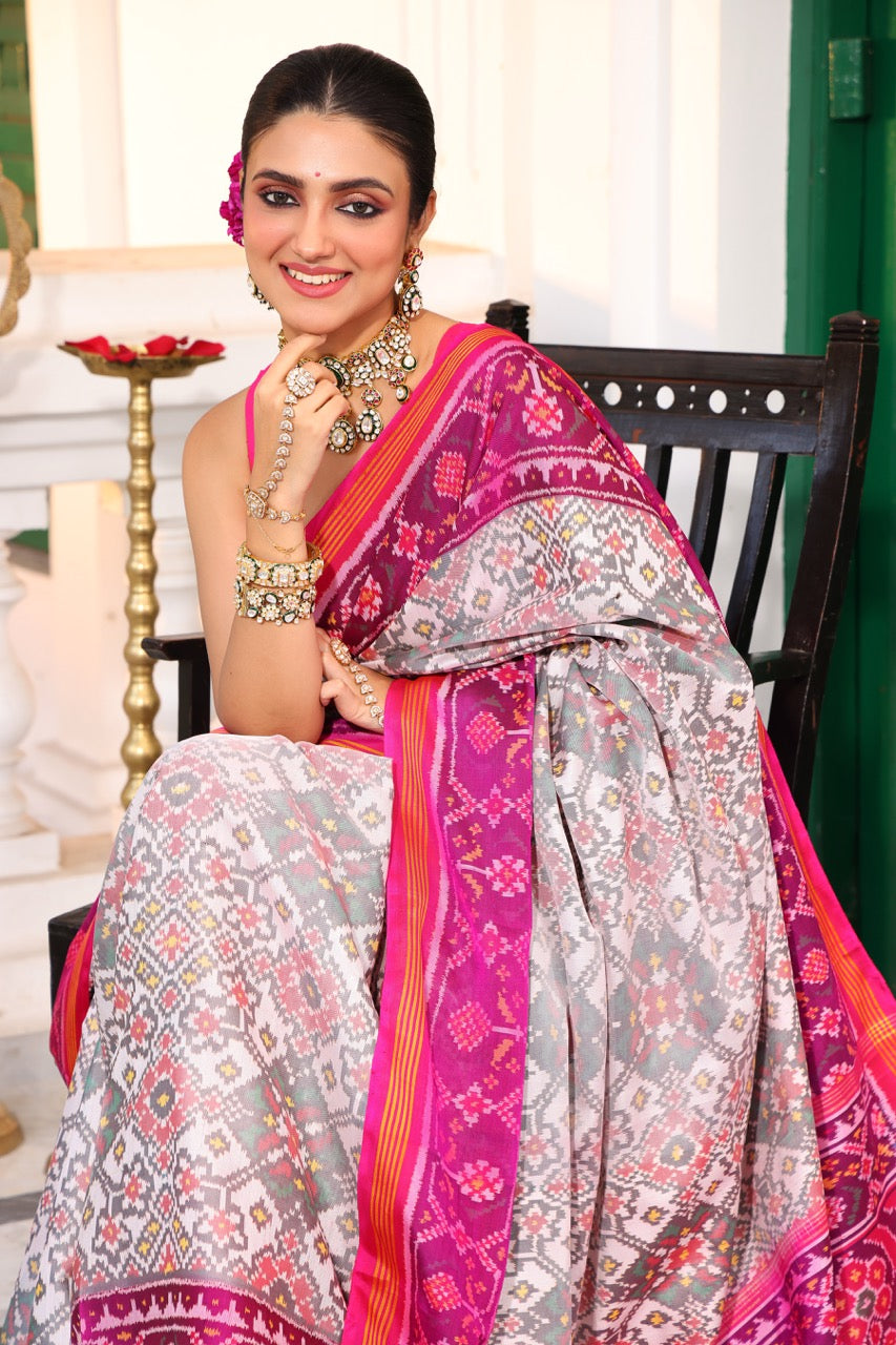 Timeless Handloom White and Pink Mulberry Silk Ikat Patola Saree with Intricate Navratna Motif