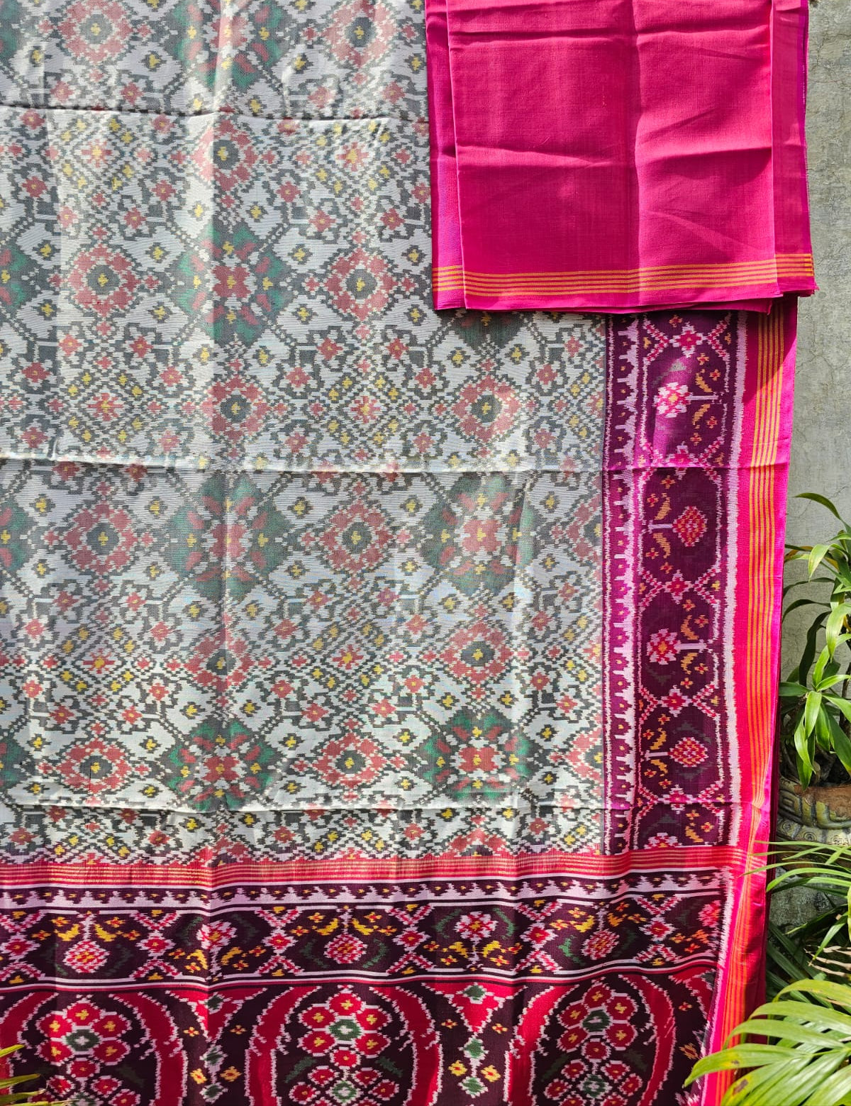 Timeless Handloom White and Pink Mulberry Silk Ikat Patola Saree with Intricate Navratna Motif