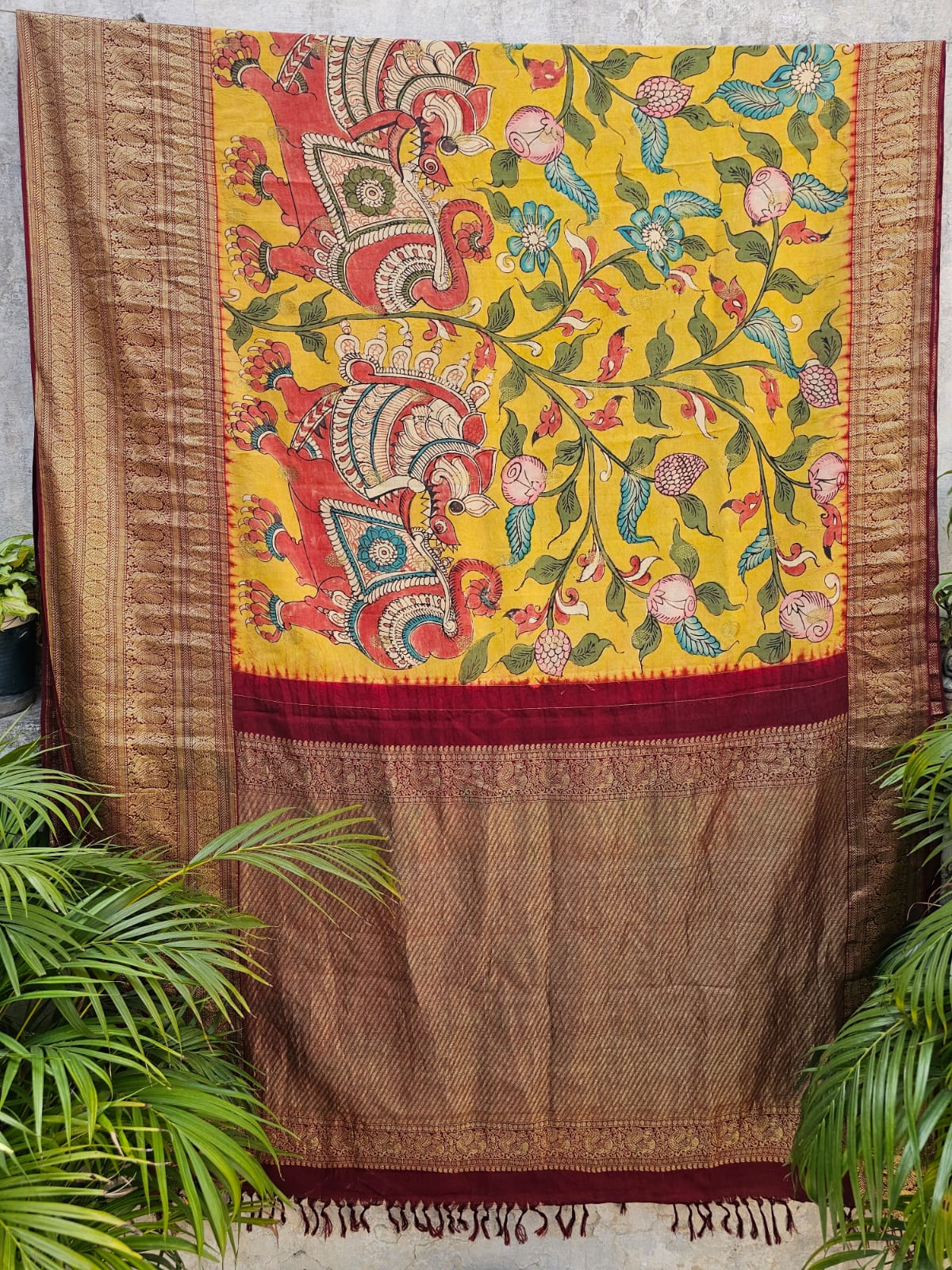 yali-floral-kanjivaram-kalamkari-saree-on-display-hanger