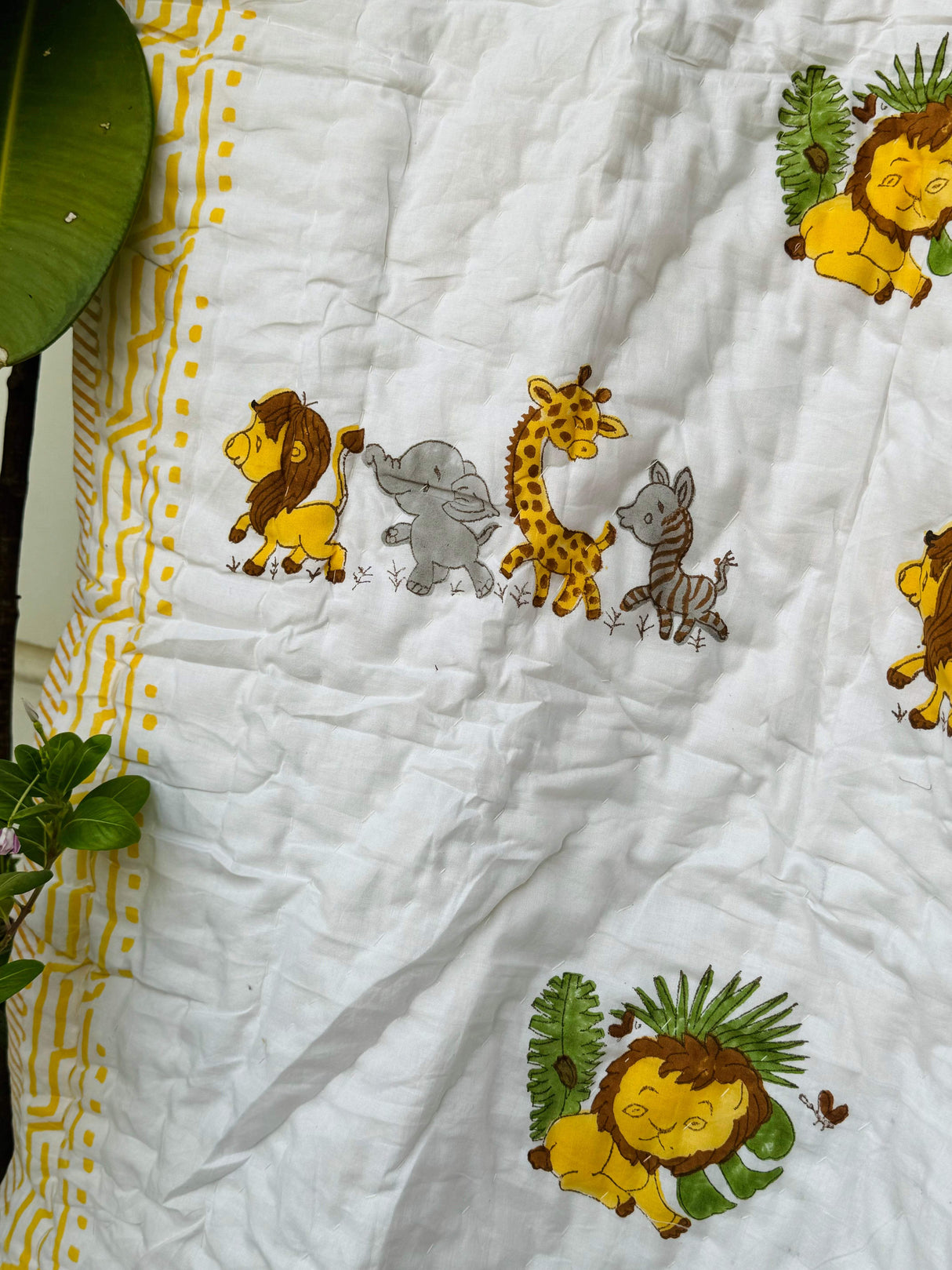 best selling handmade toddler quilt featuring Lion King characters in soft summer colors for gifting in UK and Dubai